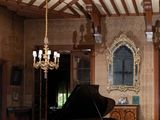 a grand piano sitting in the middle of a large room