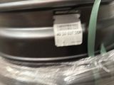 a suitcase that is wrapped in plastic and sitting on the floor