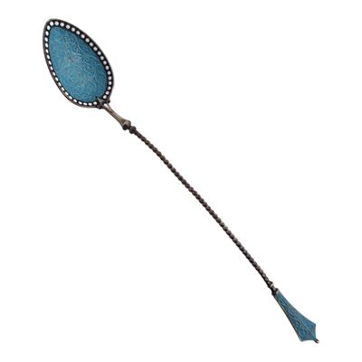 an image of a blue spoon with a long handle on a white background