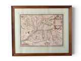 a framed map of the city of london in a wooden frame