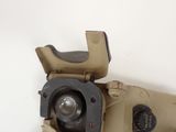 a close up of an old camera on a white surface