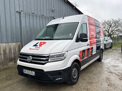a white van that is parked in front of a building