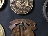 some of the medals are on display on a black surface