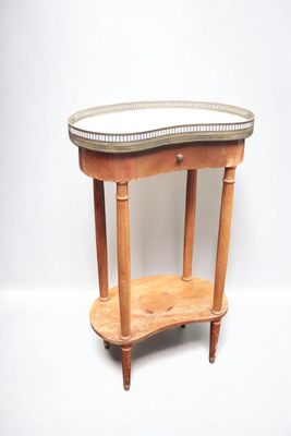 a small wooden table with a mirror on top of it