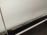 a close up of a car door with a handle on it