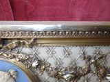 a gold frame with a picture of a woman on it