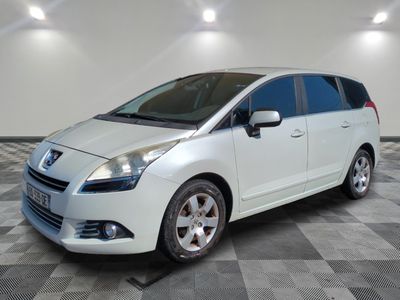 a picture of a white minivan parked on a checkered floor
