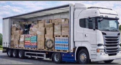 a truck with a trailer full of boxes on the back