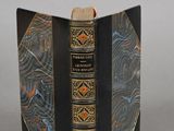 a black book with a gold and blue design on it