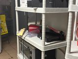 a shelf that has many different types of electronics on it
