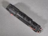 a toy train on a table with a gray background