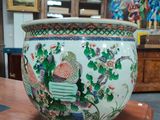 a large vase sitting on a table in a room