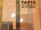an image of a book on a wooden floor with a black and orange design