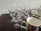 a table with a bunch of glasses and plates on it