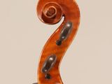 an old violin with a wooden bow on a white background