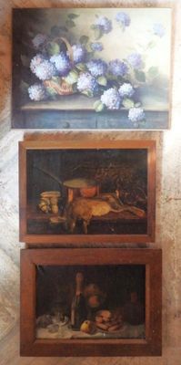 two paintings on the wall of a room with pictures on the wall
