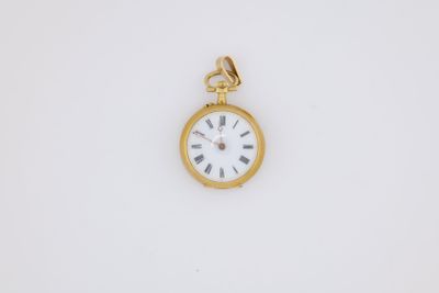 an antique gold pocket watch with roman numerals on the face