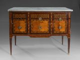 an antique sideboard with marble top and two drawers