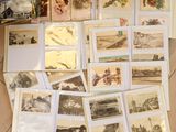 a lot of old postcards on the floor