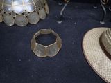 two hats and a hat stand on a table