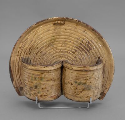 a wooden bowl with two sections of wood in the middle