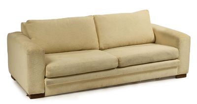 an image of a beige couch sitting on top of a white floor