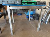 an image of a workbench with tools on top of it