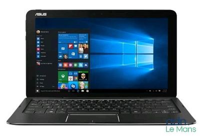 the asus laptop is open and ready to use