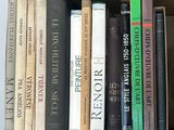 many books that are in a box on the table