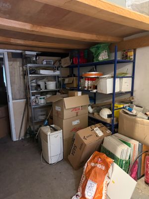 a room with a lot of boxes and boxes on the floor