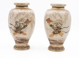 two vases that are sitting on a white surface