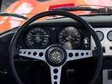 a steering wheel and gauges in the dashboard of a car