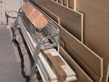 several pieces of wood are stacked on top of each other in a room