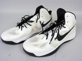 pair of white and black sneakers with black laces on a white surface