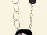 black and white necklace with a black and white picture of a bird