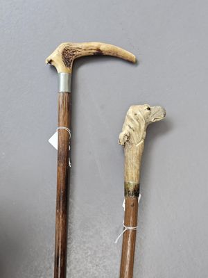 two old walking canes that are next to each other