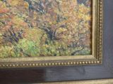 an oil painting of a tree with yellow leaves in a black frame