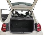 the back of a white car with its trunk open and the back door open
