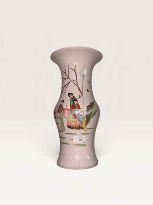 a small vase with a painting on it on a white surface
