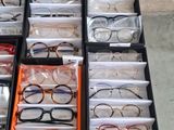 a lot of glasses that are sitting on a table