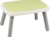a small table with a green top and grey legs