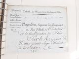 an old document with writing on it sitting on a table