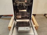 a dishwasher that is sitting in the middle of the floor