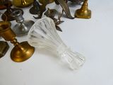 a lot of antique brass and glass items on the table