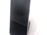 a cell phone that is sitting on top of a stand