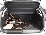 a trunk of a car with a bunch of wires in it