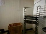 an image of a room with a shelf and a basket