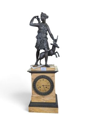 a statue of a woman with a dog and a clock