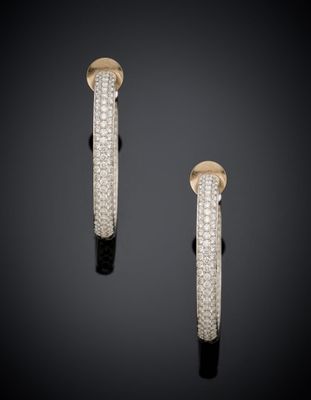 a pair of gold and diamond hoop earrings