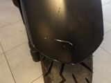 a close up of a motorcycle tire on a tile floor